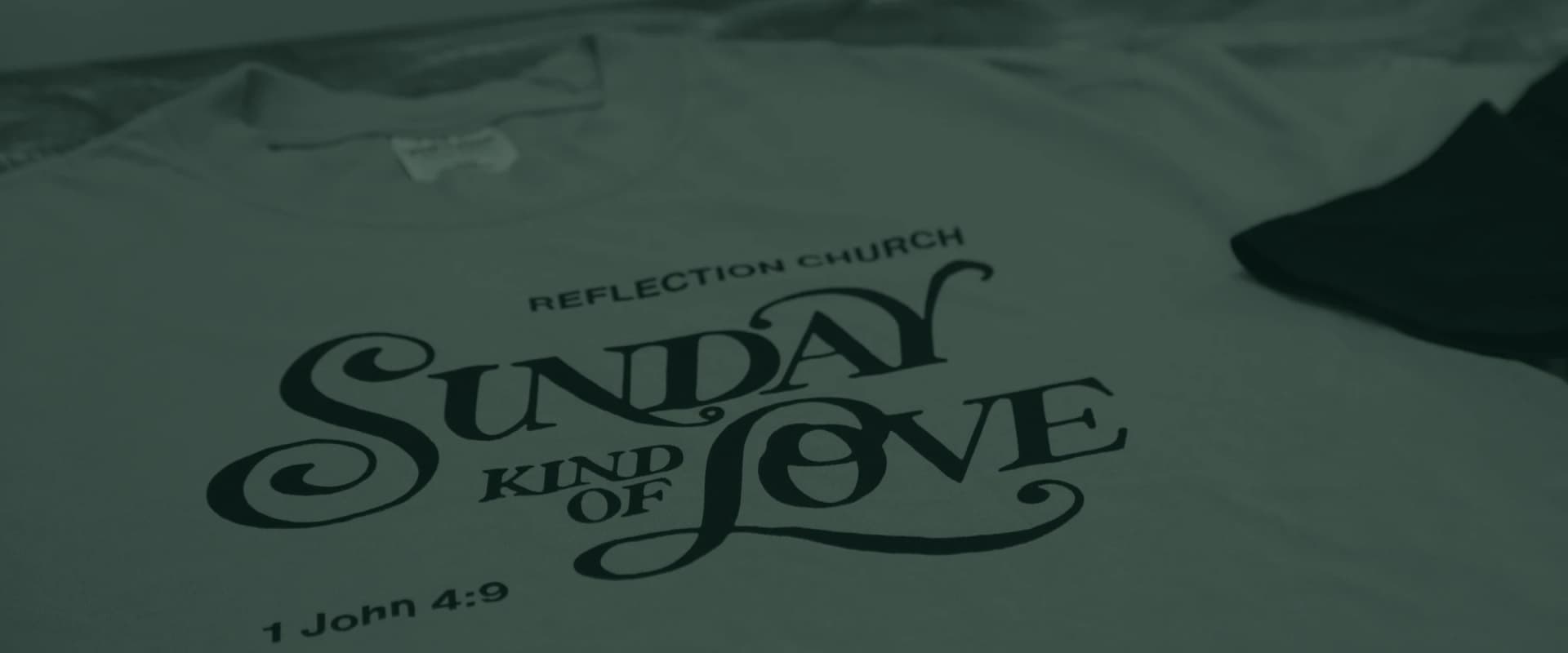 A Reflection Church shirt reading Sunday Kind of Love, 1 John 4:9