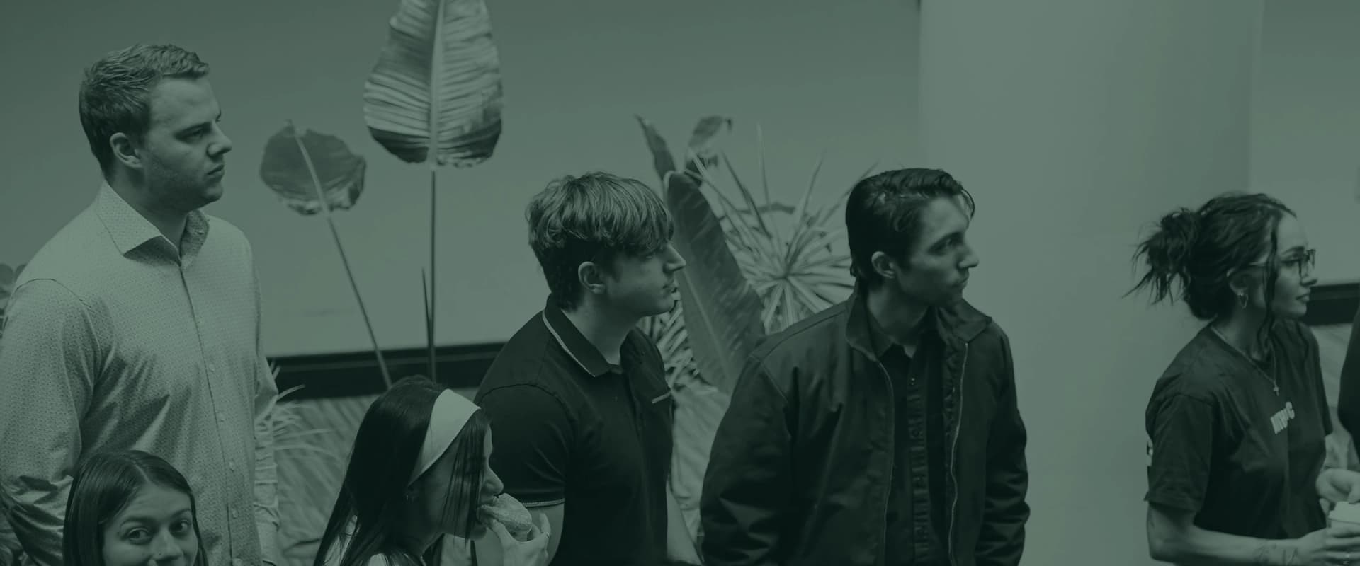 Several young adults talking together over coffee before the service