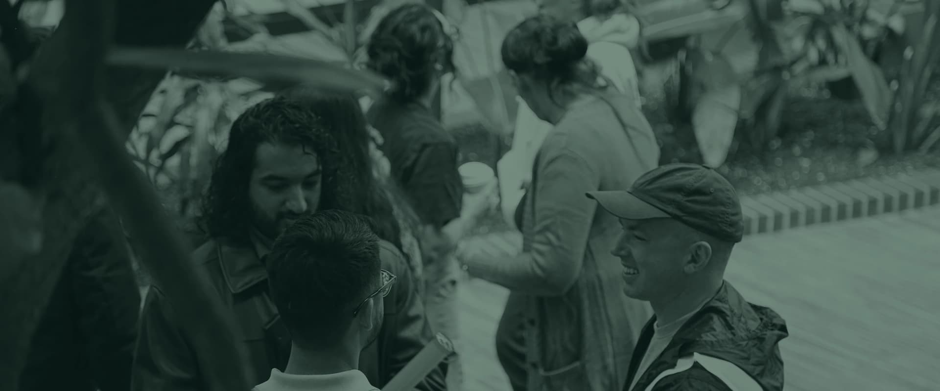 People greeting each other and shaking hands as they arrive